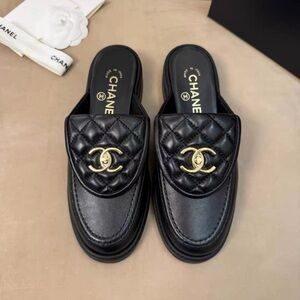 CHANEL Black Quilted Leather Slip-On Mules with Gold CC Emblem
